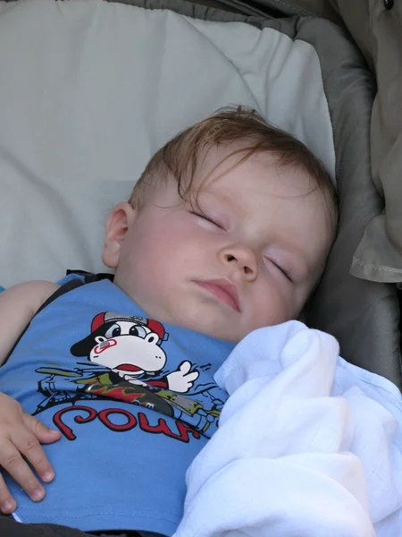 Baby sleeping in a stroller — Stock Photo, Image