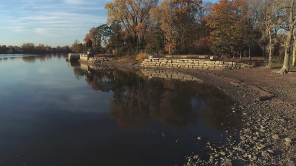 Flying Drone Backward Shore Calm River Fall Naked Trees Sunset — Stockvideo