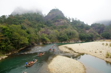 Bamboo rafting in Wuyishan mountains, China clipart