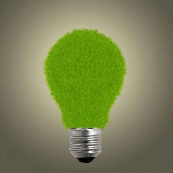 Green grass on light bulb — Stock Photo, Image