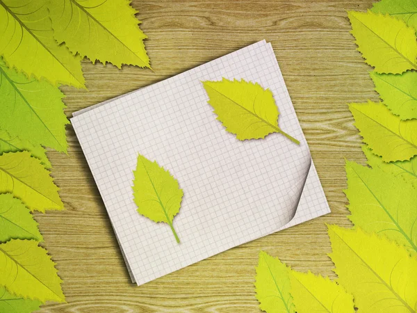 Green leaves over wooden background — Stock Photo, Image