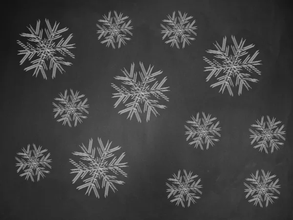 Flocos de neve em chalkboard — Fotografia de Stock