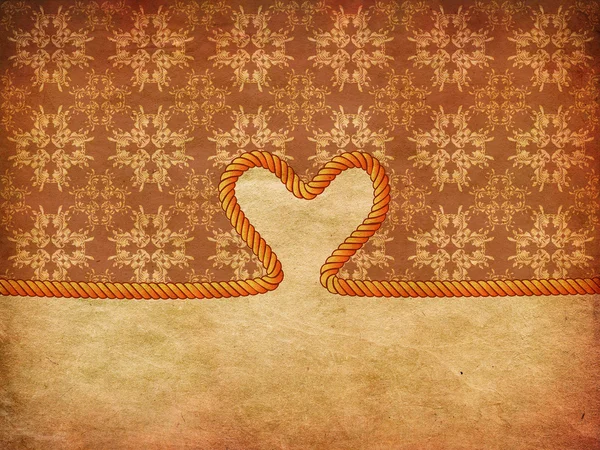 Rope heart on decorative paper — Zdjęcie stockowe