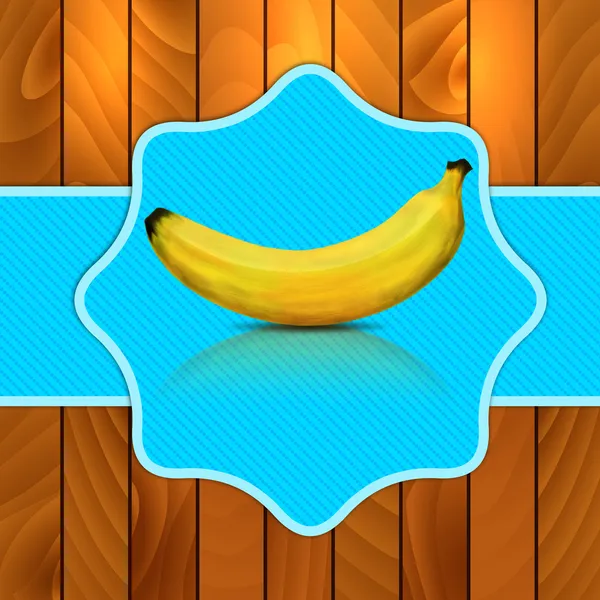 Банан на синьому фоні — стокове фото