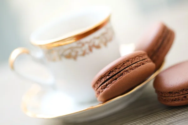 Chocolate macarons and cup of coffee — Stock Photo, Image