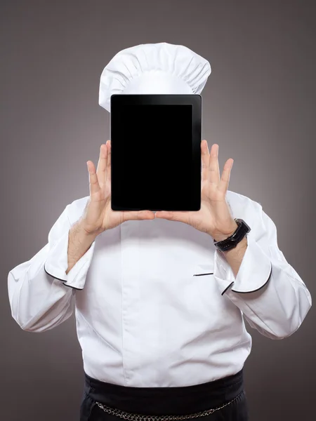 Chef-kok achter de digitale tablet — Stockfoto