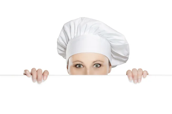 Female chef looking over billboard — Stock Photo, Image