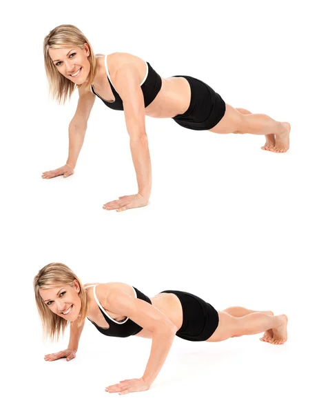 Fit young athletic woman doing push ups — Stock Photo, Image