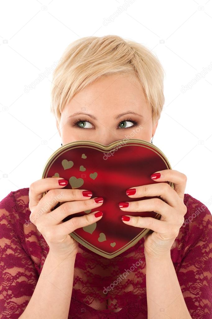 Woman with valentine's gift and funny look