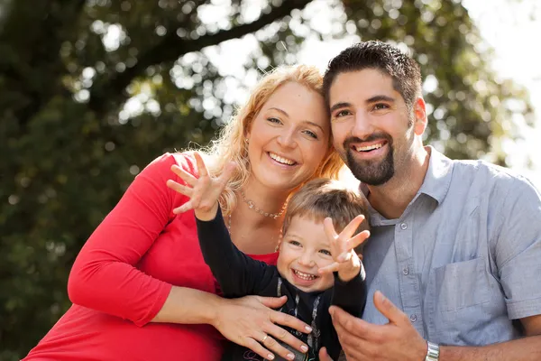 Young family in nature — Stock Photo, Image