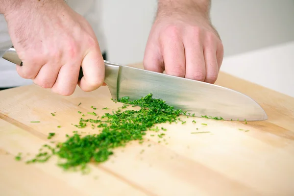 Chef chopping parsley — Stock Photo, Image