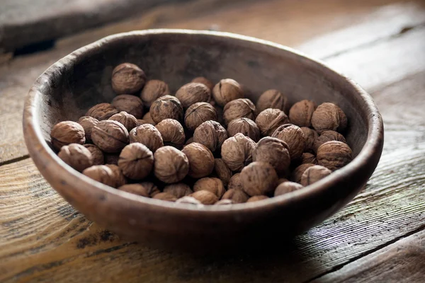 Walnuts in  wooden bowl — Stock Photo, Image