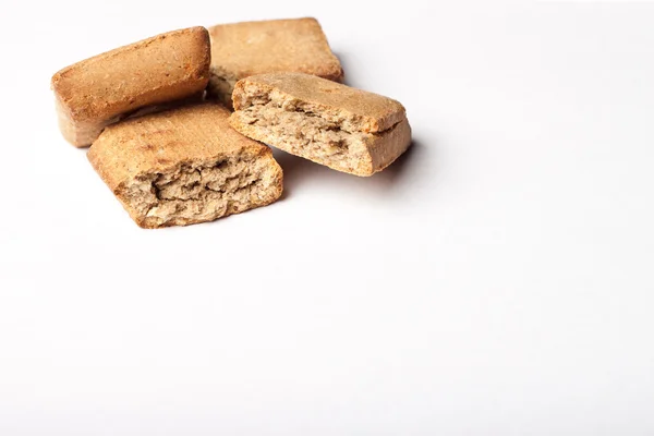 A few dog treats on a white surface — Stock Photo, Image