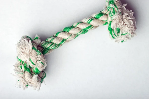 Knotted rope dog toy on white surface — Stock Photo, Image