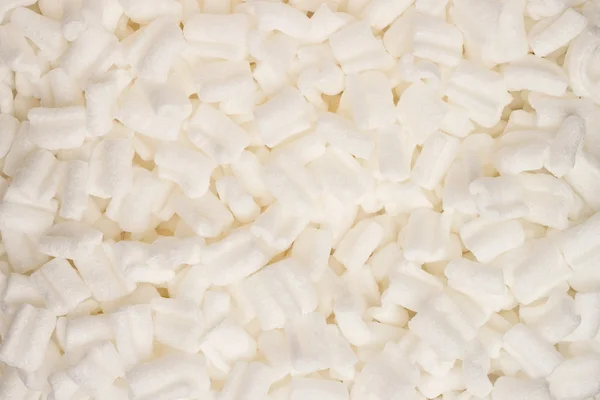 Background containing light packing peanuts — Stock Photo, Image