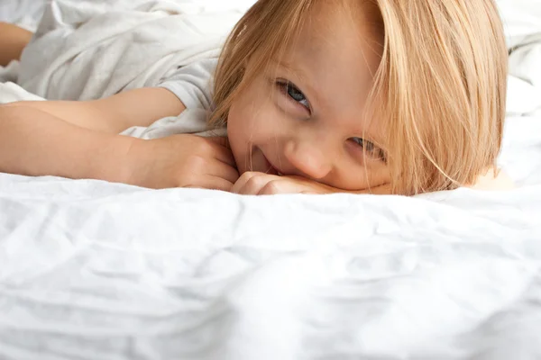 Beautiful little girl smiling after waking up — Stock Photo, Image