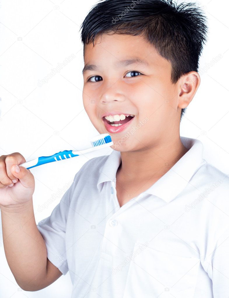 Child holding toothbrush