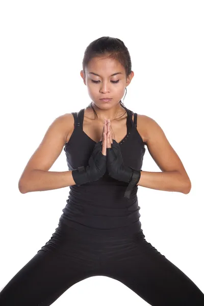 Female fitness trainer in exercise position — Stock Photo, Image