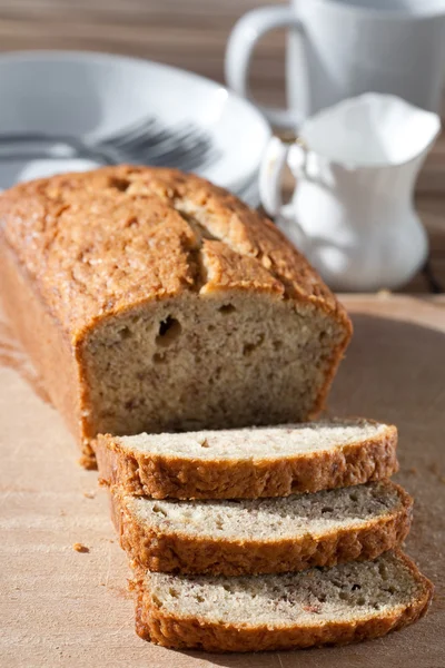 Delicious freshly baked banana bread on wooden board — Stock Photo, Image