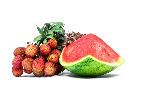 Isolated arrangement of fruit, watermelon, pineapple and lychees. — Stock Photo, Image