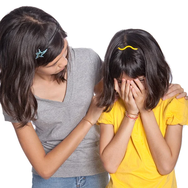 Big sister comforting her younger sister. — Stock Photo, Image
