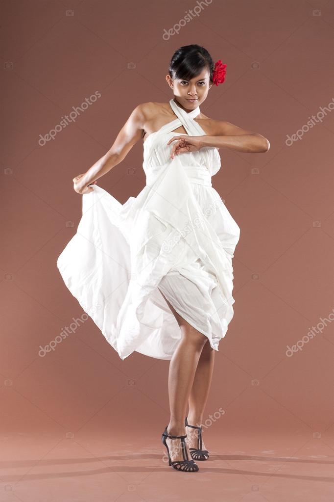 Beautiful flamenco dancer in white dress
