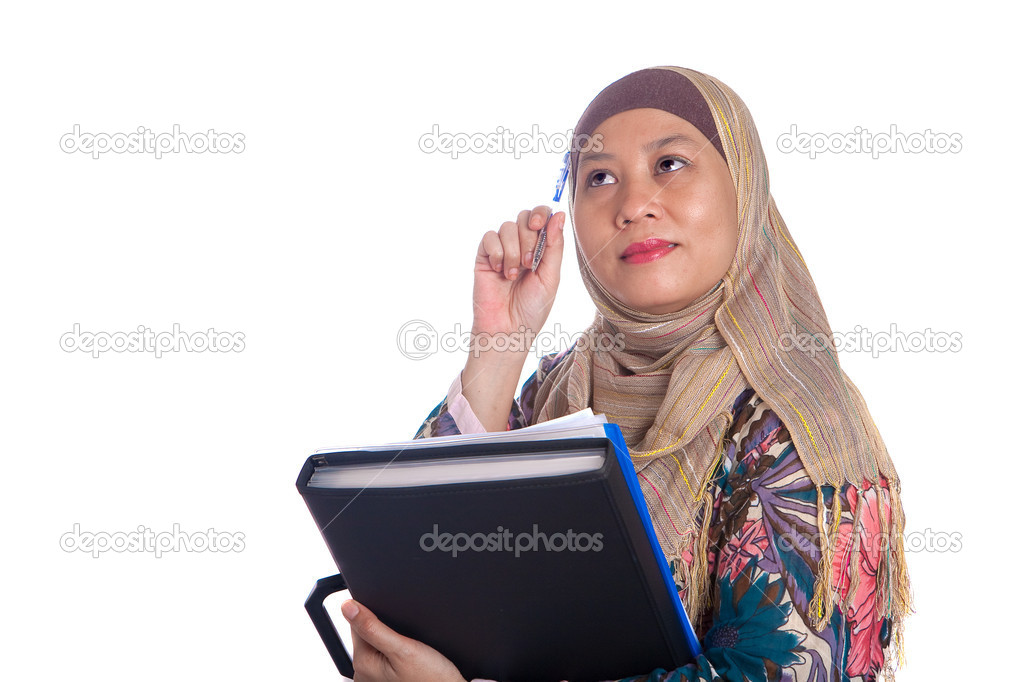 Beautiful mature Muslim woman in thinking pose with files and books in hand