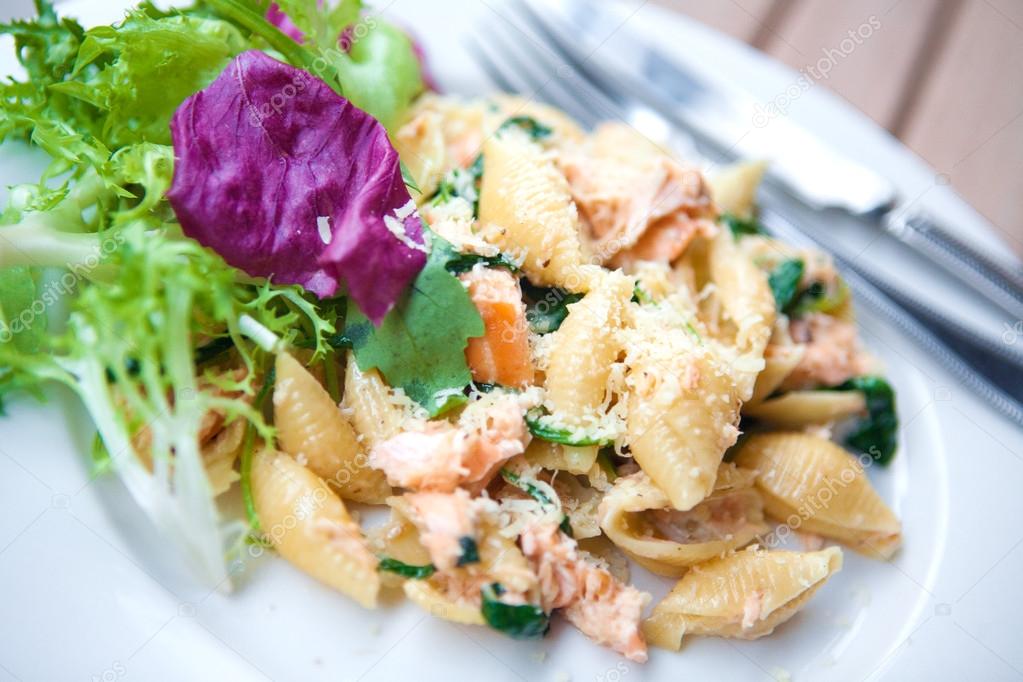Delicious pasta with salmon and spinach.