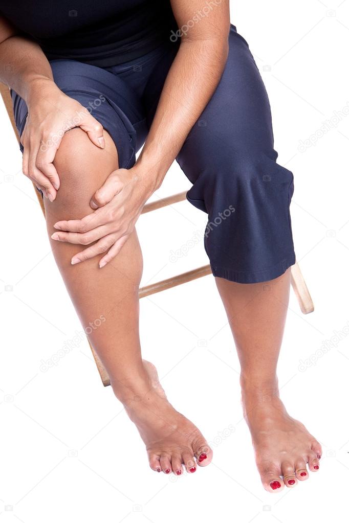 Woman suffering from pain in knee due to injury