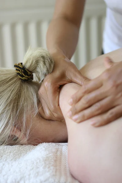 Woman receiving a back massage Stock Photo