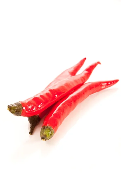 Bunch of red hot chili peppers on white — Stock Photo, Image