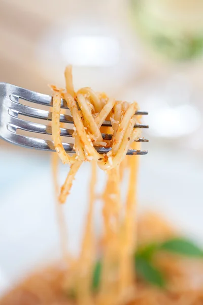 Forkful of spaghetti in tomato sauce — Stock Photo, Image