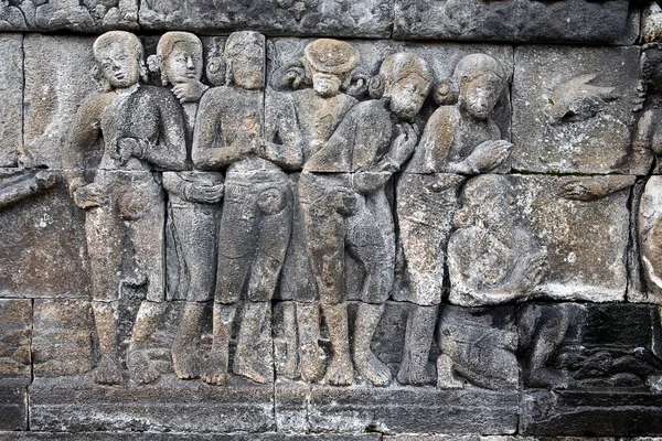 Relief carved stone of ancient Buddhist cosmology at the Borobudur temple — Stock Photo, Image