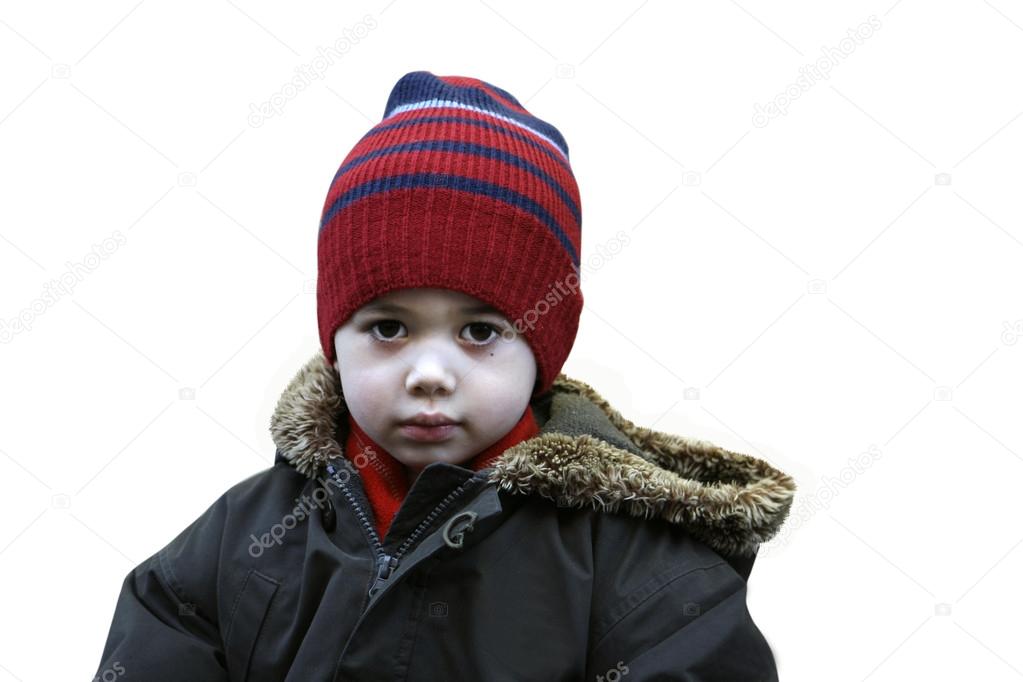 Beautiful little boy in winter coat and hat