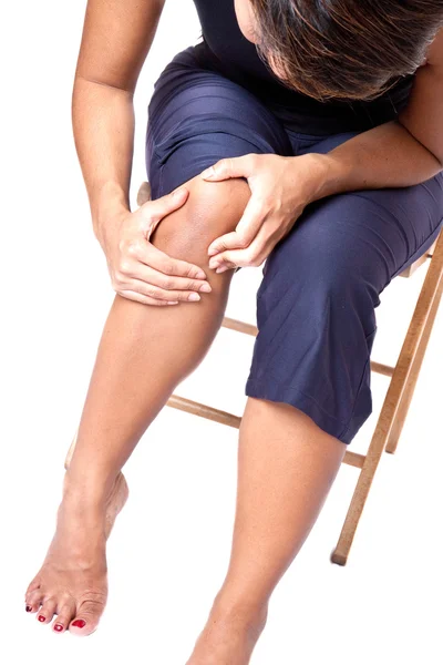 Young woman suffering from knee pain — Stock Photo, Image