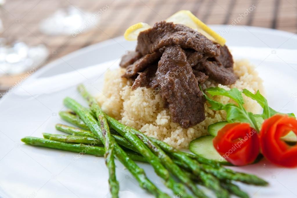 Delicious lamb cous cous with grilled asparagus
