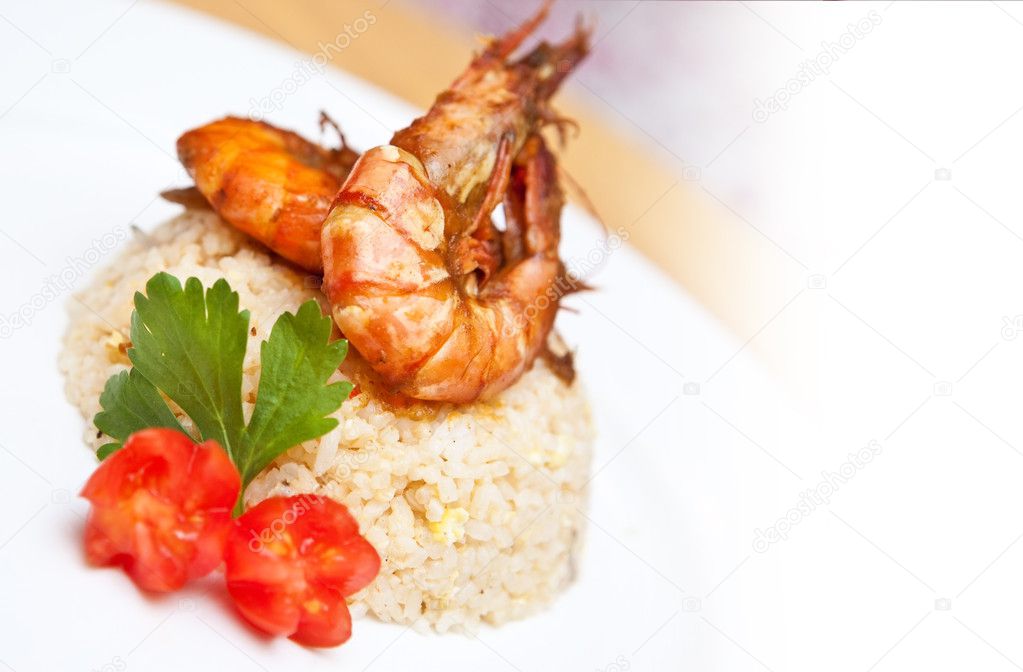 Delicious plate of Asian fried rice with tiger prawns