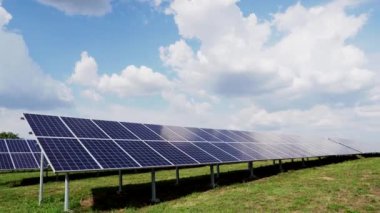 Blue solar power station panels in a row in the fields green energy. Electrical ecology innovation nature environment.