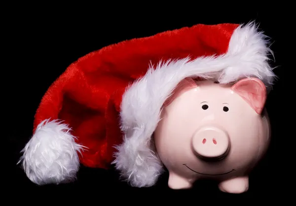 Santa hat piggy bank — Zdjęcie stockowe