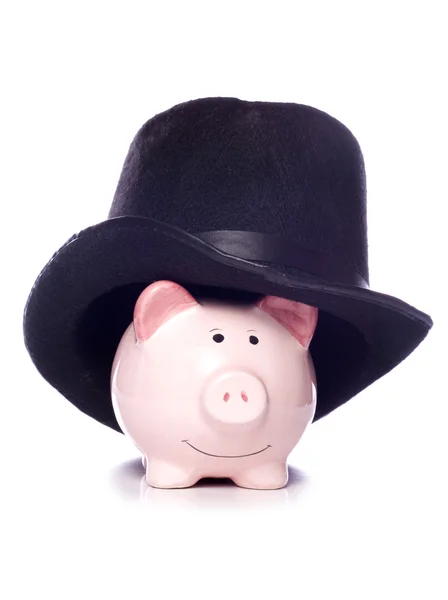 Piggy bank draagt een hoge hoed knipsel — Stockfoto