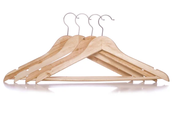 Four wooden coat hangers cutout — Stock Photo, Image