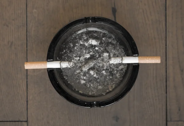 Two cigarettes in an ash tray — Stock Photo, Image