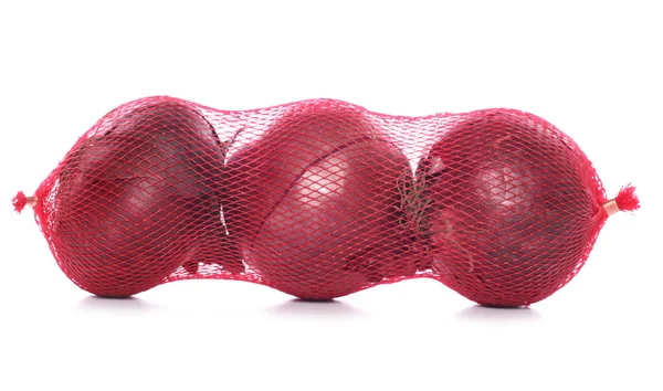 Zak met drie rode uien — Stockfoto