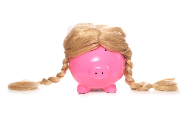 Banco porquinho usando uma peruca — Fotografia de Stock