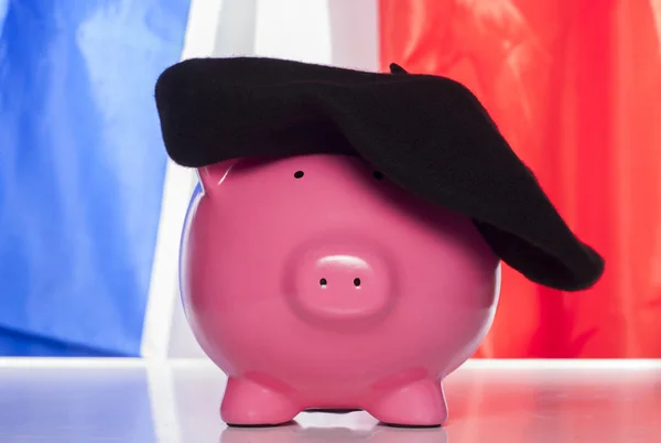 Piggy bank op een Franse vlag — Stockfoto