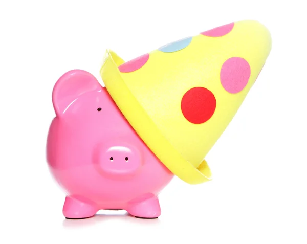 Piggy bank wearing party hat — Stock Photo, Image