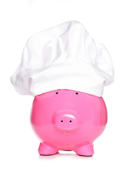 Banco porquinho usando chapéu de chefs — Fotografia de Stock