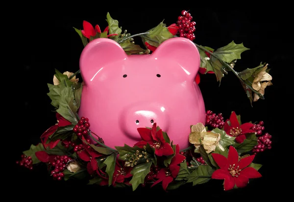 Sparschwein und Weihnachtsgirlanden — Stockfoto