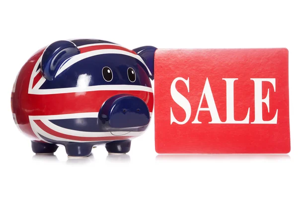 Piggy bank met verkoop teken — Stockfoto