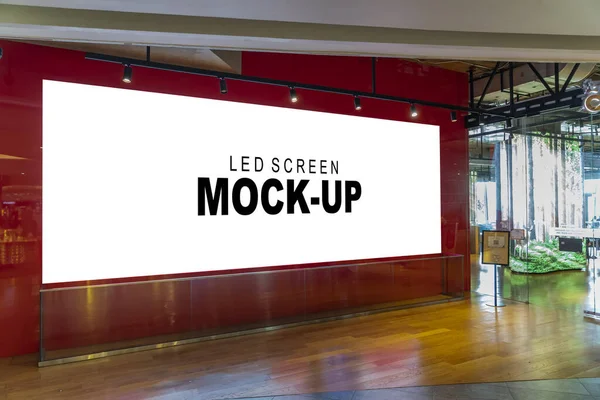 Mockup horizontal advertising LED Screen Install at entrance glass door with clipping path, empty space for insert your text, announcement, multi-media content and advertisement in shopping mall